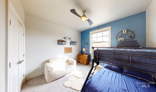 bedroom with baseboards, carpet, and ceiling fan