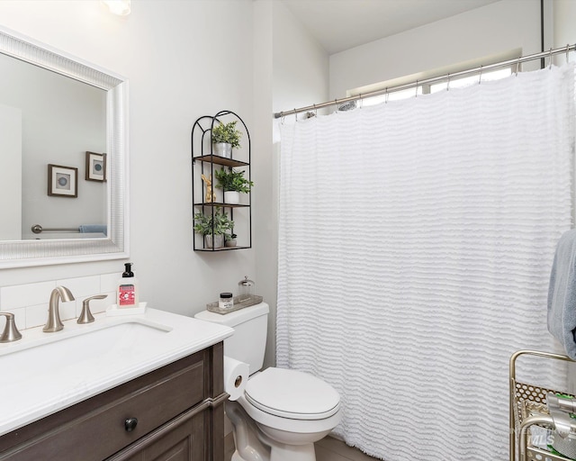 bathroom with toilet and vanity