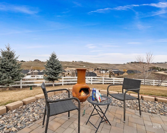 view of patio featuring fence