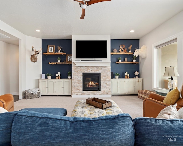 carpeted living room with recessed lighting, a fireplace, and a ceiling fan