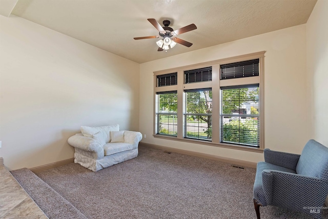 4315 N Nuova Ave, Meridian, ID 83646 - living area featuring carpet floors, visible vents, baseboards, and ceiling fan