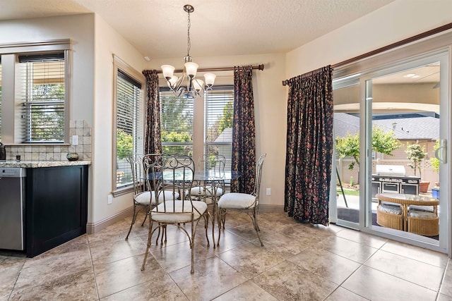 4315 N Nuova Ave, Meridian, ID 83646 - dining space with baseboards, a chandelier, and a textured ceiling