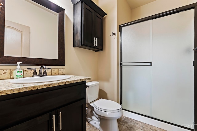 4315 N Nuova Ave, Meridian, ID 83646 - bathroom featuring a stall shower, tile patterned flooring, vanity, and toilet