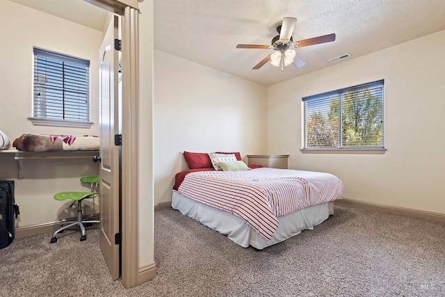 4315 N Nuova Ave, Meridian, ID 83646 - bedroom with carpet floors, visible vents, baseboards, and a ceiling fan