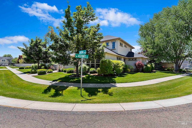 4315 N Nuova Ave, Meridian, ID 83646 - view of front of property featuring fence, a front lawn, and stucco siding