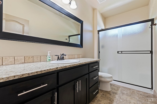 4315 N Nuova Ave, Meridian, ID 83646 - bathroom featuring a stall shower, visible vents, vanity, and toilet