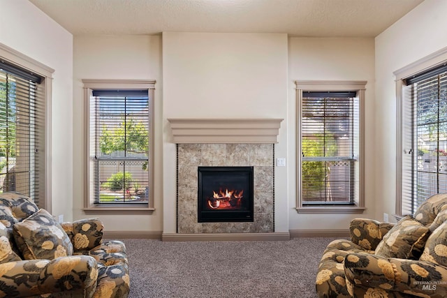 4315 N Nuova Ave, Meridian, ID 83646 - carpeted living room with a textured ceiling and a tiled fireplace