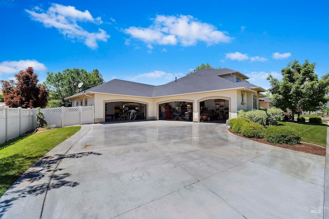 4315 N Nuova Ave, Meridian, ID 83646 - view of home's exterior featuring a garage, stucco siding, driveway, and a lawn
