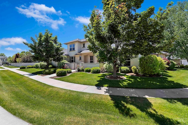 4315 N Nuova Ave, Meridian, ID 83646 - obstructed view of property with a front lawn, fence, and stucco siding
