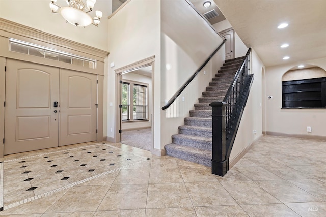 4315 N Nuova Ave, Meridian, ID 83646 - tiled foyer entrance featuring stairway, baseboards, visible vents, and recessed lighting