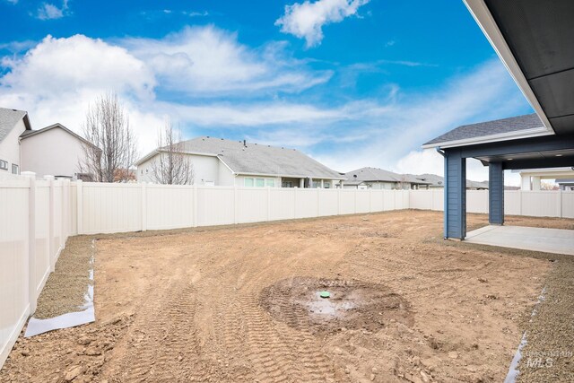 view of yard featuring a fenced backyard and a patio area