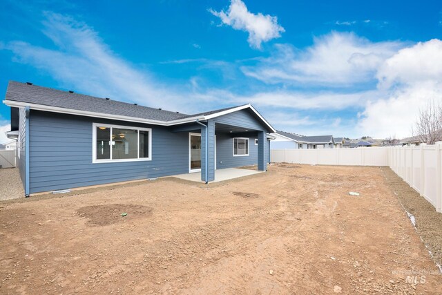 back of house featuring a patio and a fenced backyard