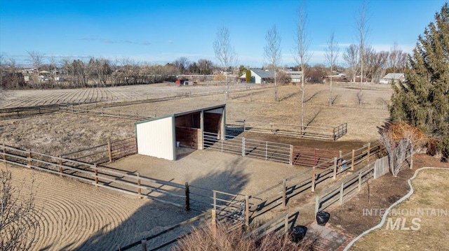 view of stable featuring a rural view