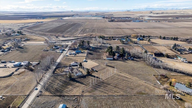 birds eye view of property with a rural view