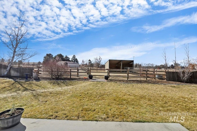 view of yard with an outdoor structure and an exterior structure