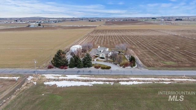 birds eye view of property with a rural view