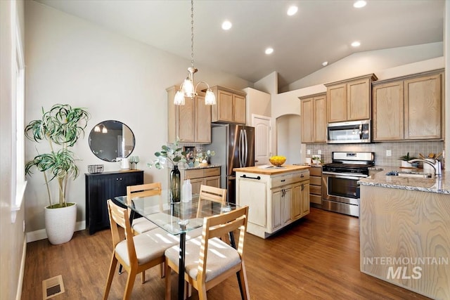 kitchen with light brown cabinets, sink, dark hardwood / wood-style floors, and stainless steel appliances