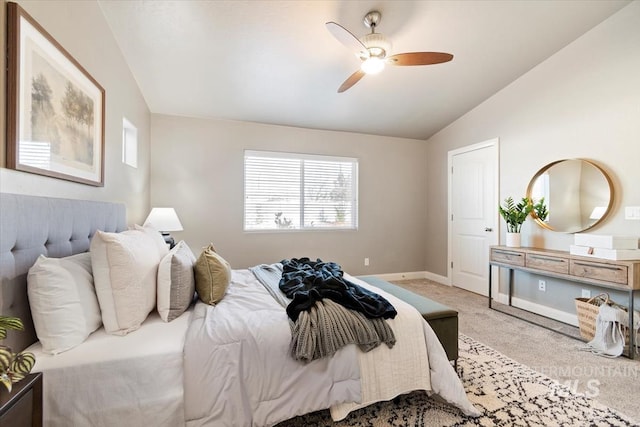 carpeted bedroom featuring vaulted ceiling and ceiling fan