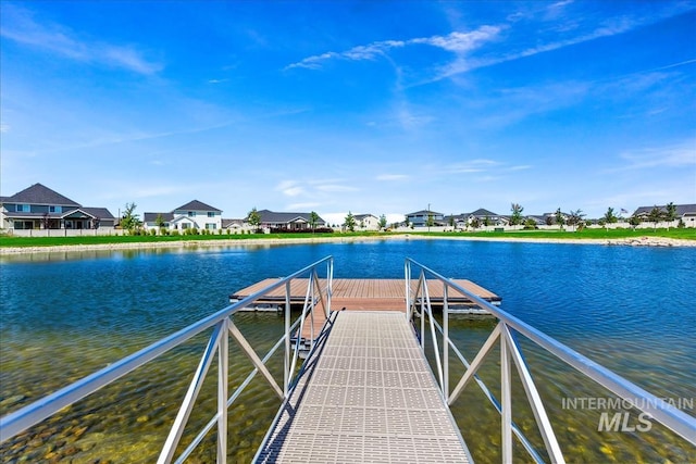 dock area with a water view