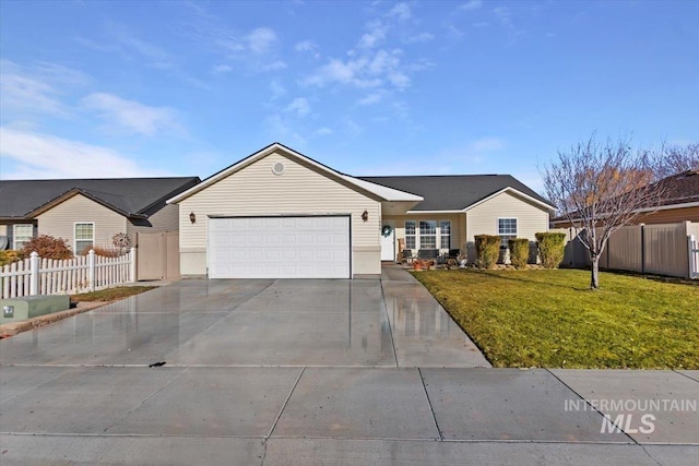 ranch-style home with driveway, fence, a front yard, and a garage
