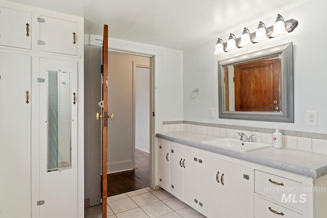 bathroom featuring tile patterned floors and vanity