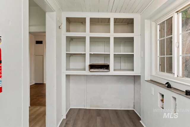 room details with wood finished floors, baseboards, built in features, and wooden ceiling