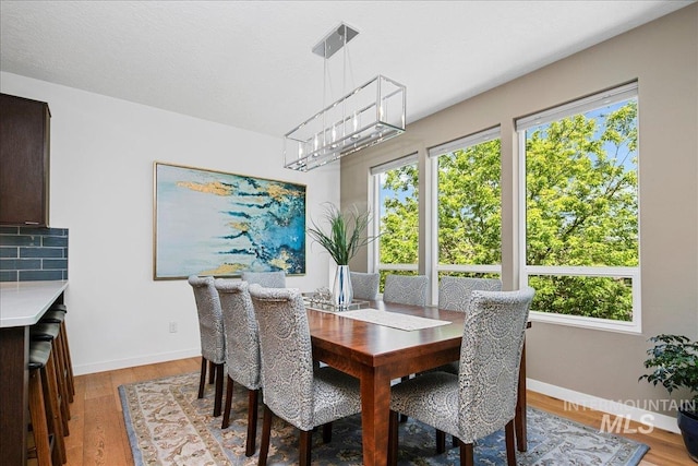 3602 N Prospect Way, Garden City, ID 83714 - dining space with light wood-type flooring and baseboards