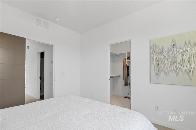 3602 N Prospect Way, Garden City, ID 83714 - bedroom featuring carpet, a spacious closet, baseboards, and a closet