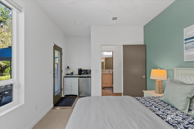 3602 N Prospect Way, Garden City, ID 83714 - carpeted bedroom with fridge and baseboards