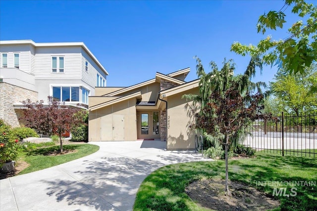 3602 N Prospect Way, Garden City, ID 83714 - view of front facade with stone siding, fence, and stucco siding