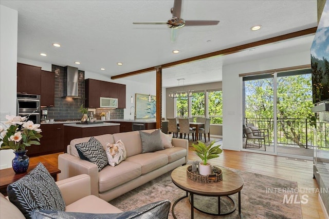 3602 N Prospect Way, Garden City, ID 83714 - living room featuring light wood finished floors, ceiling fan, and recessed lighting