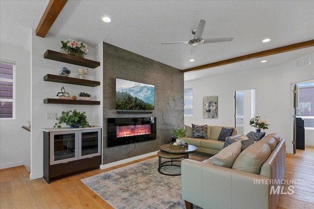 3602 N Prospect Way, Garden City, ID 83714 - living room with a ceiling fan, light wood-style floors, beam ceiling, a large fireplace, and recessed lighting