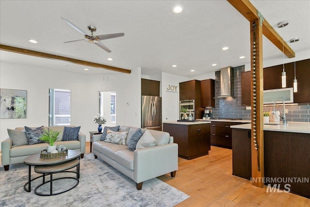3602 N Prospect Way, Garden City, ID 83714 - living room featuring light wood-style flooring, beamed ceiling, recessed lighting, and ceiling fan