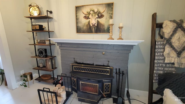 details featuring baseboards and a wood stove