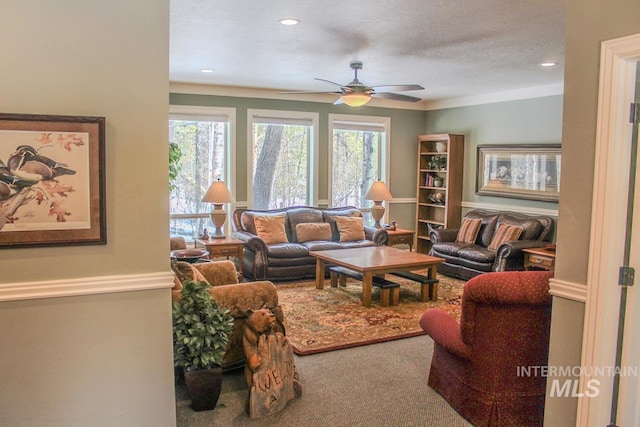 carpeted living room featuring ceiling fan, a textured ceiling, and a wealth of natural light