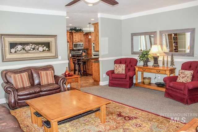 living room with light carpet and ceiling fan