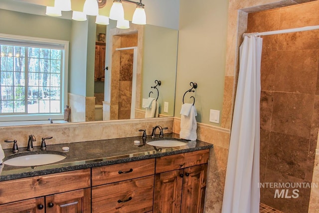 bathroom with vanity and walk in shower