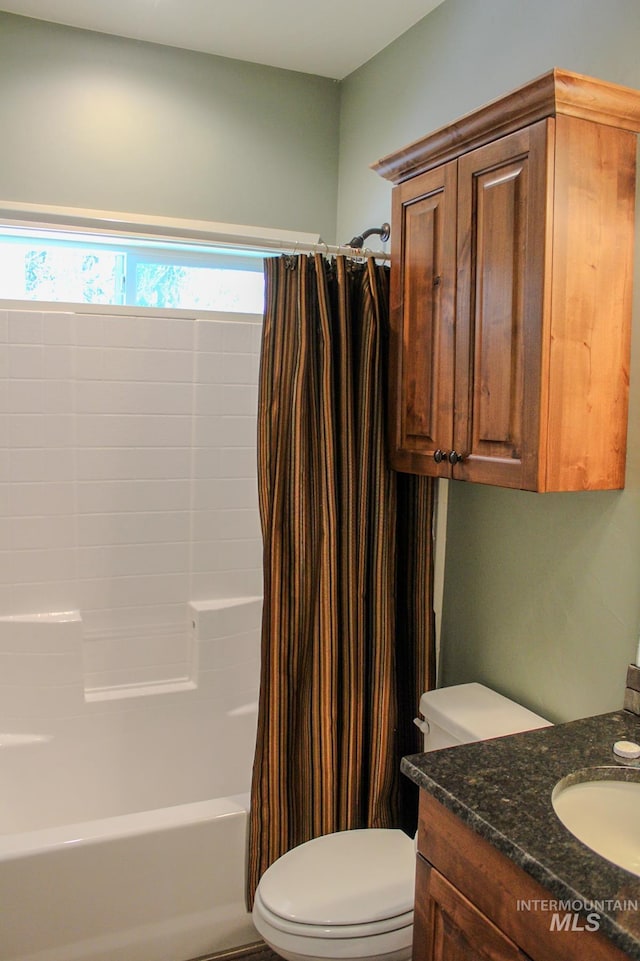 full bathroom featuring vanity, toilet, and shower / bath combo with shower curtain