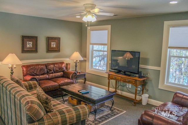 living room with carpet and ceiling fan