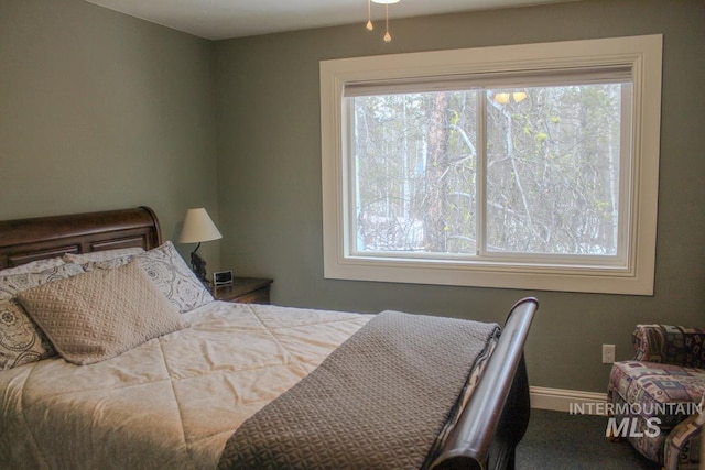 bedroom with multiple windows