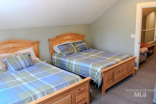 carpeted bedroom featuring lofted ceiling