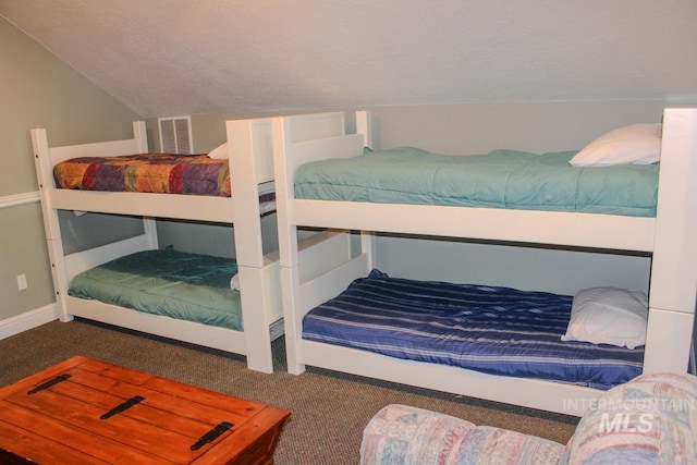 bedroom featuring vaulted ceiling and carpet floors