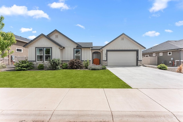 1670 Mary Hill Ave, Middleton, ID 83644 - view of front of home featuring board and batten siding, a garage, stone siding, and concrete driveway