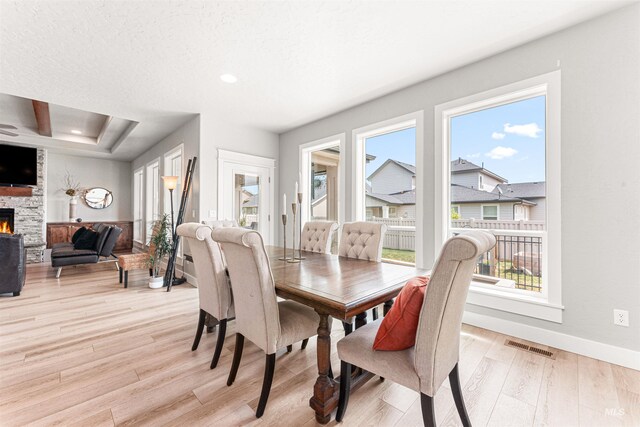 1670 Mary Hill Ave, Middleton, ID 83644 - dining space with light wood-style floors, a stone fireplace, baseboards, and recessed lighting