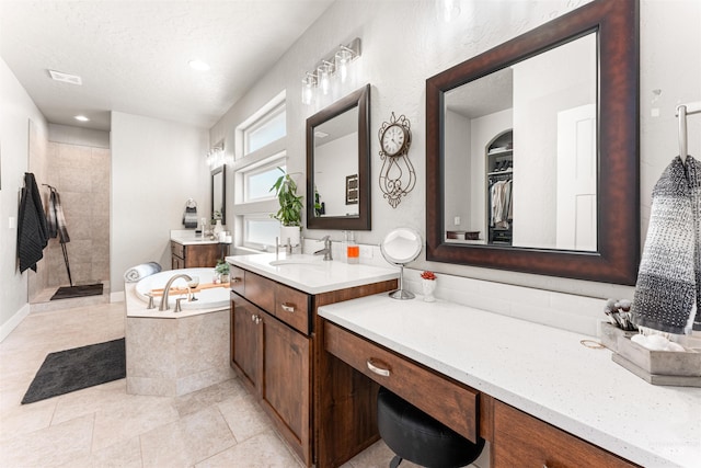 1670 Mary Hill Ave, Middleton, ID 83644 - full bath with a walk in shower, a bath, vanity, a textured ceiling, and tile patterned flooring