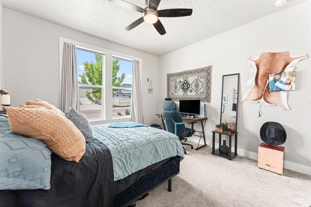 1670 Mary Hill Ave, Middleton, ID 83644 - carpeted bedroom with a textured ceiling, ceiling fan, baseboards, and a desk