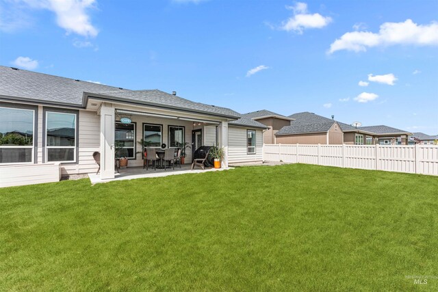 1670 Mary Hill Ave, Middleton, ID 83644 - back of property with a patio and a shingled roof