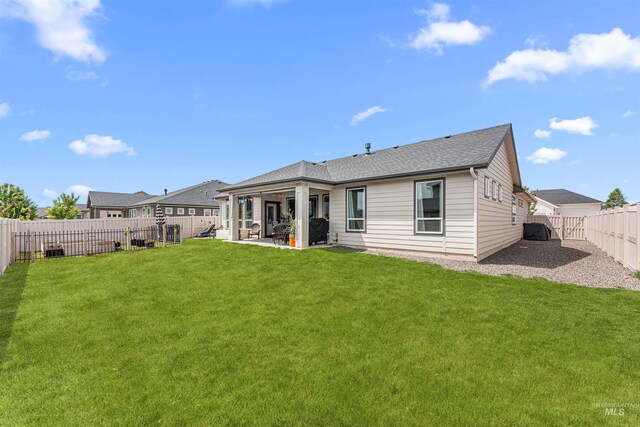 1670 Mary Hill Ave, Middleton, ID 83644 - rear view of house featuring a patio and a shingled roof