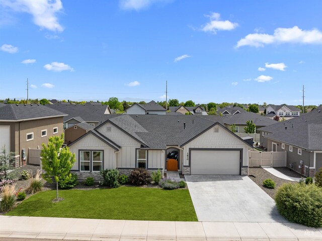 1670 Mary Hill Ave, Middleton, ID 83644 - view of front of home with a residential view, board and batten siding, stone siding, and an attached garage