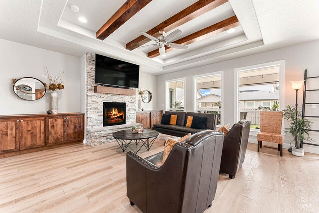 1670 Mary Hill Ave, Middleton, ID 83644 - living area featuring a tray ceiling, light wood finished floors, and healthy amount of natural light